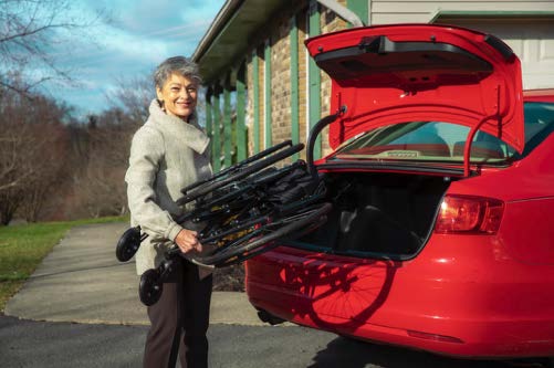 Feather Heavy Duty Wheelchair 22" Nova Medical folded for transport in trunk.